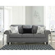 The same charcoal sofa in a chic living room setting, complemented by elegant decor, showcasing its full potential as a statement piece in a home interior.