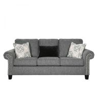 A stylish charcoal sofa adorned with nailhead trim, geometric throw pillows, and a black faux fur kidney pillow, isolated on a white background.